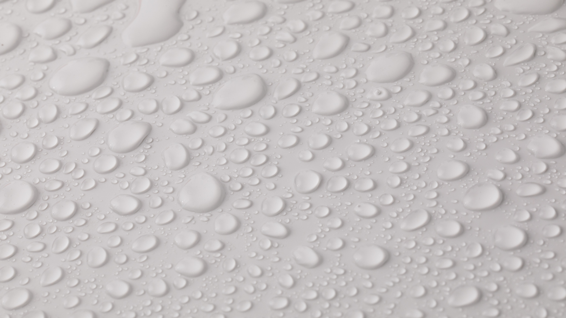 Close-up of water droplets beading on eco-friendly waterproof paper
